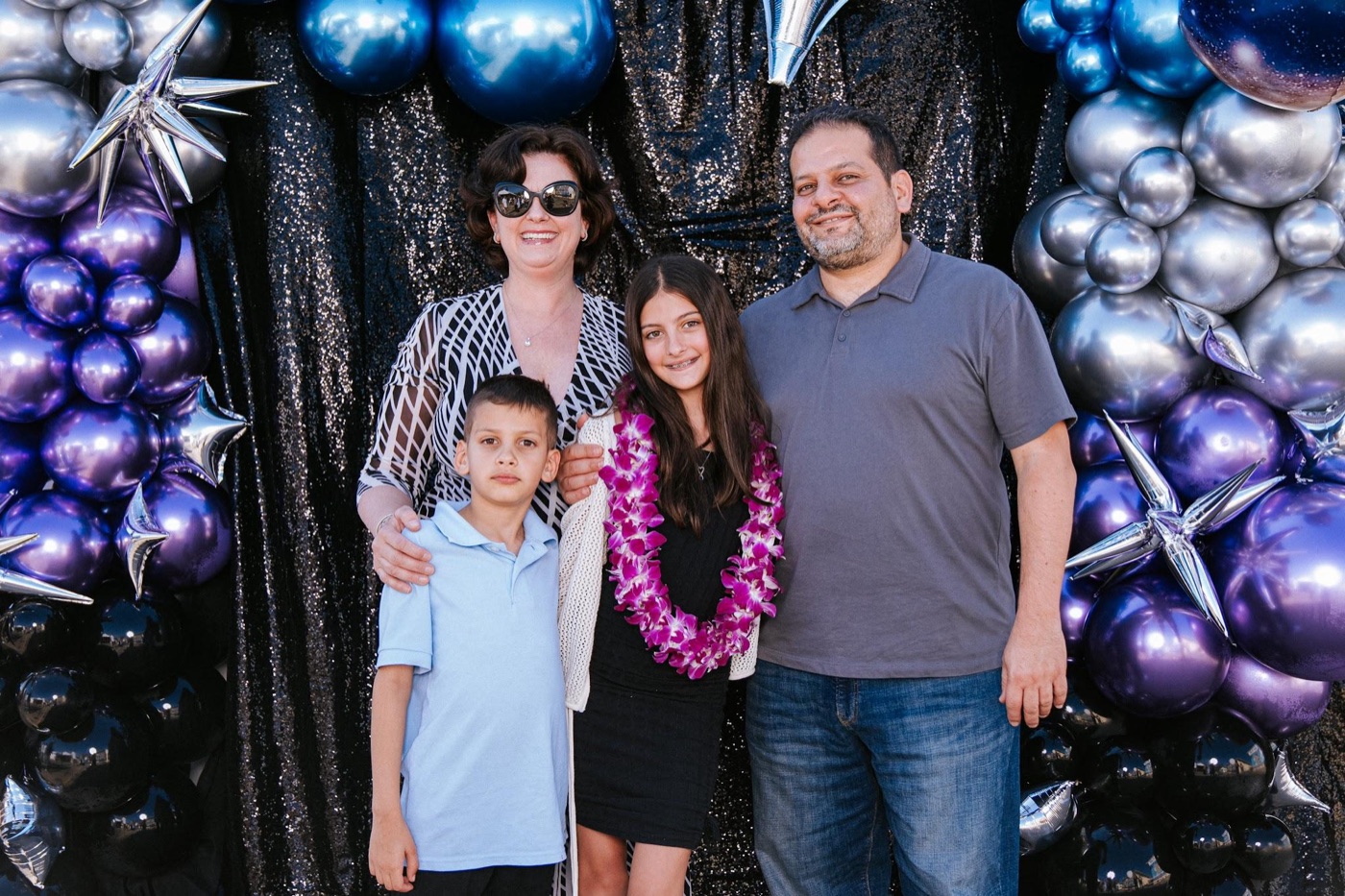 Deborah Nicolaou, SCJ PA Volunteer Coordinator, with her family