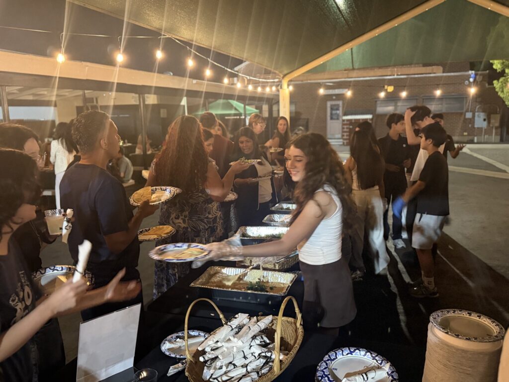 Guests serving themselves desserts at the buffet