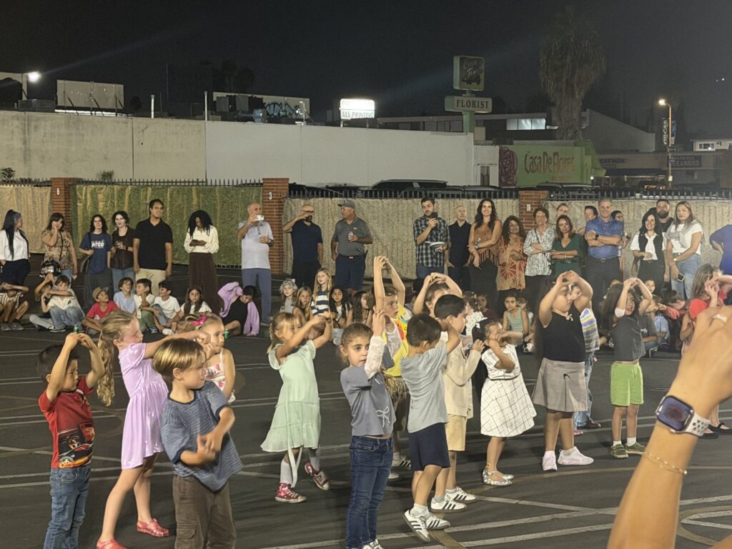 Young kids dancing together on the blacktop