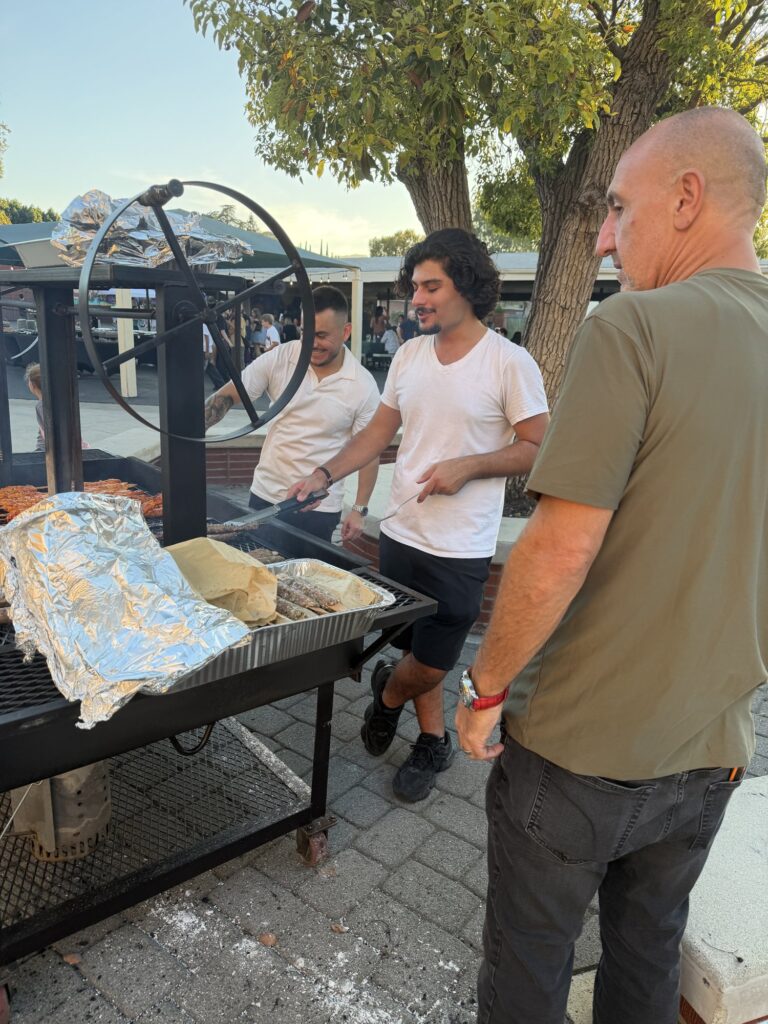Volunteers grilling kebabs on the barbecue