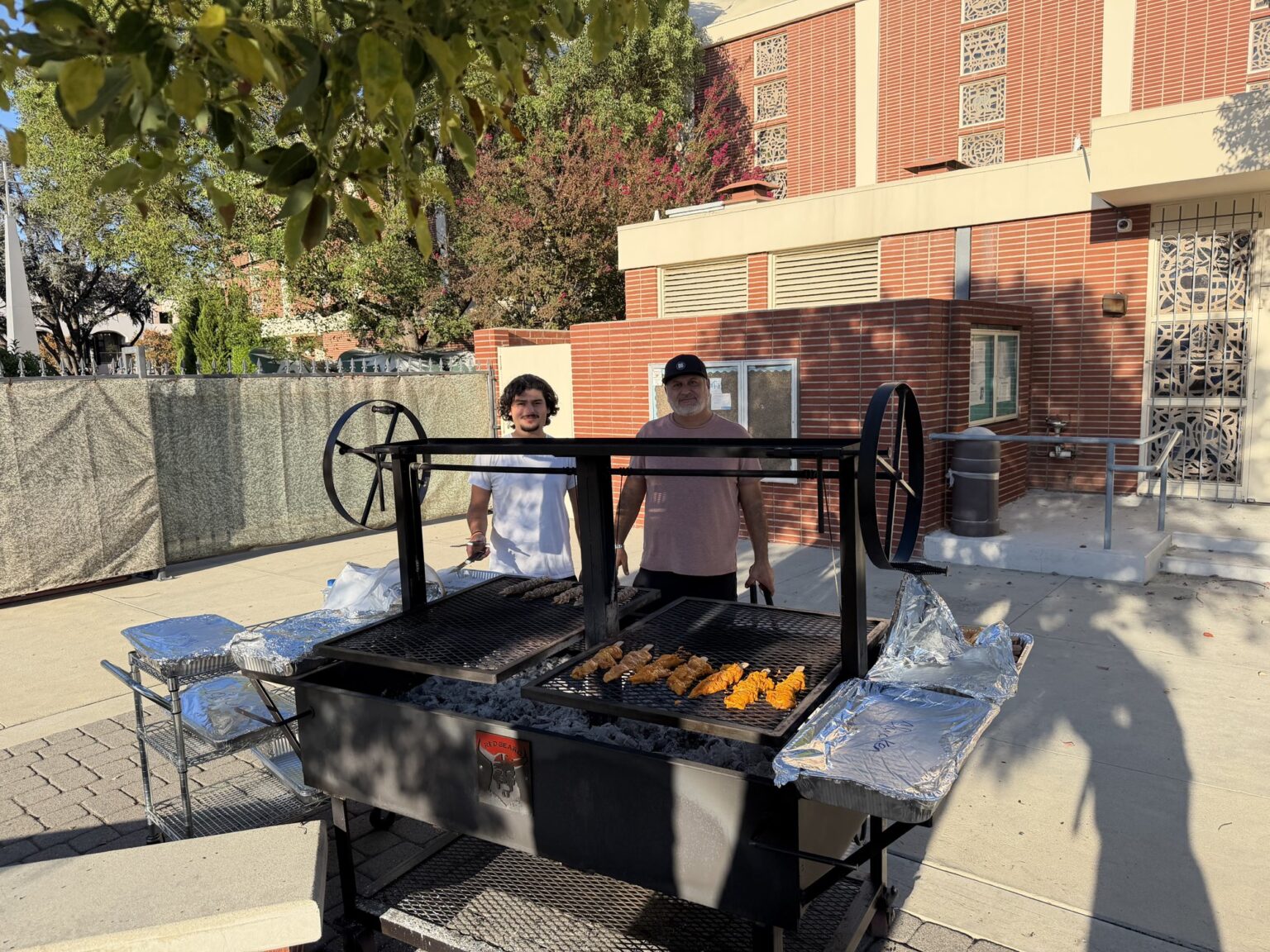 The barbecue grill set up in the school courtyard in the afternoon sun