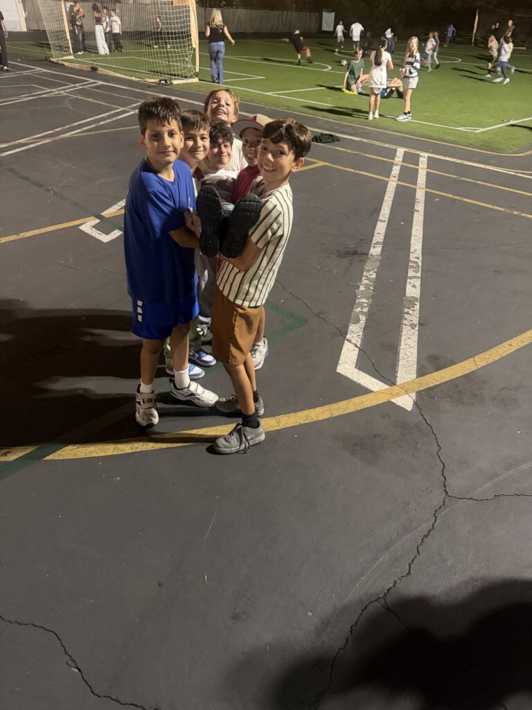 Kids playing together on the school field