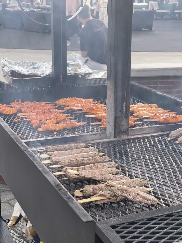 Chicken and kefta skewers cooking on the grill