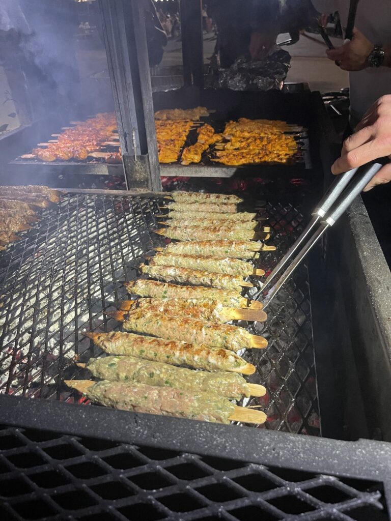 Close-up of rows of skewers on the grill